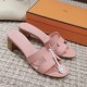 Hermes Oasis Sandals In Light Violet - Pair With Box in violet and white Pair of light violet Hermes Oasis sandals displayed in front of an orange brand box in violet and white