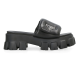 Prada Black Slide Profile View Profile view of Prada black nappa leather slide showing the chunky platform and padded strap