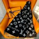 L Women's Monogram Black And White Scarf Draped L Women's Monogram Black And White Scarf draped over a chair with packaging box