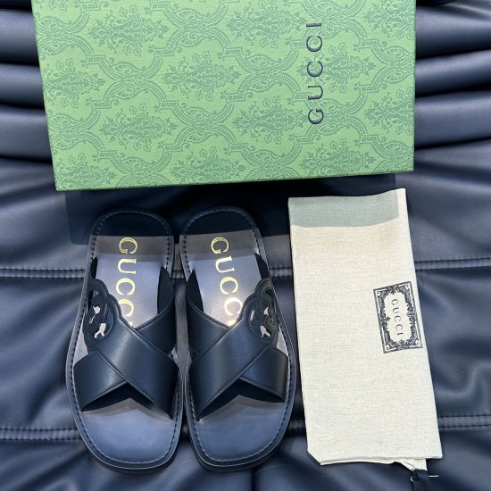 Gucci Black Leather Sandals with Box and Dust Bag Gucci black leather sandals displayed next to a green patterned box and dust bag