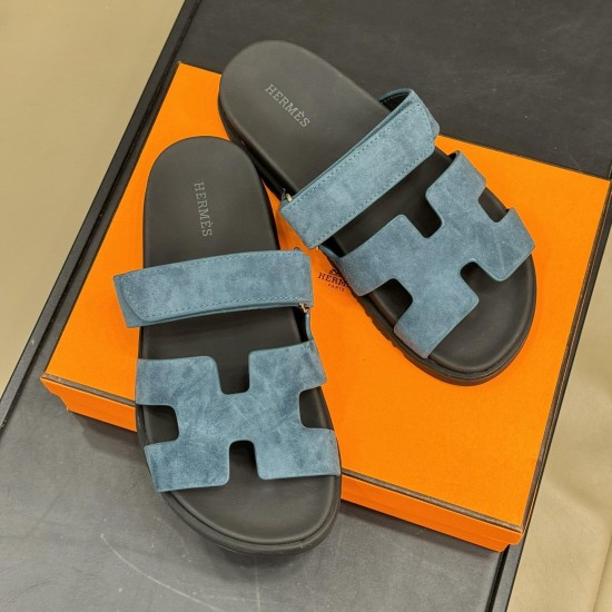 Hermes Chypre Blue Suede Sandals Top View Top down view of the blue suede sandals resting on an orange box displaying interior branding