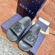 Gucci black slide sandals top down view Gucci black slide sandals viewed from above highlighting the footbed branding