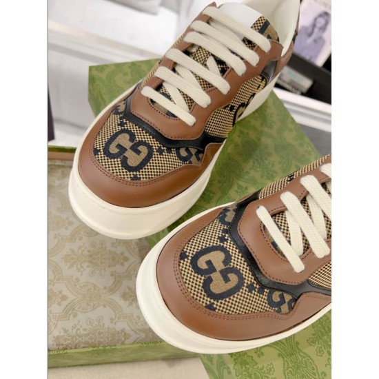 Gucci Brown Monogram Trainers Toe Detail View in brown and green Close-up view of toe caps on Gucci brown monogram canvas trainers in brown and green