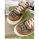 Gucci Brown Monogram Trainers Toe Detail View in brown and green Close-up view of toe caps on Gucci brown monogram canvas trainers in brown and green