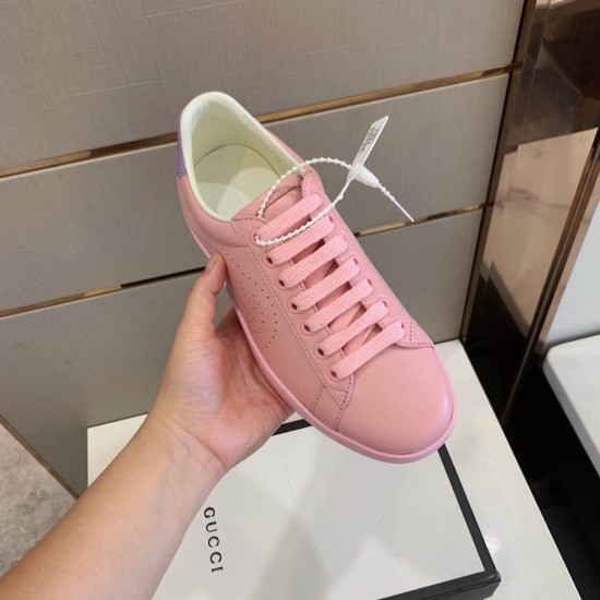 Handheld Front View of Gucci Pink Leather Trainer in pink and purple Hand holding single Gucci pink leather trainer displaying the front toe box and lace section in pink and purple