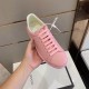 Handheld Front View of Gucci Pink Leather Trainer in pink and purple Hand holding single Gucci pink leather trainer displaying the front toe box and lace section in pink and purple