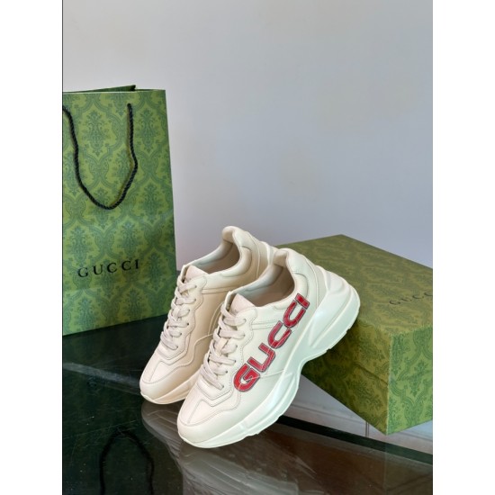 Gucci Ivory Leather Logo Printed Trainers Dynamic View Gucci Ivory Leather Logo Printed Trainers standing angled view