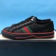 Gucci Off The Grid Black Low Top Trainers Angled View in black and red Angled side view of black Gucci Off The Grid trainer on display box in black and red