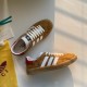 Gucci Gazelle Yellow Canvas Trainers Pair View in yellow and white Overhead view of yellow canvas Gucci Gazelle low top trainers resting alongside packaging accessories in yellow and white