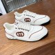 Side profile of Gucci white and brown leather logo trainers on display