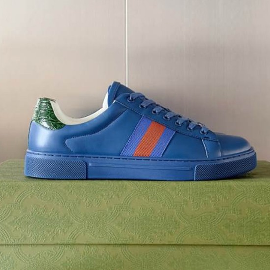 Gucci Ace Blue Leather Trainer Side View in blue and green Side profile of Gucci Ace blue leather low top trainer featuring side web stripe and green heel tab
