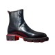 Christian Louboutin Men's Black Leather Chelsea Boots Side Profile Side view of Christian Louboutin Men's Black Leather Lug Sole Chelsea Boots showing the smooth upper and chunky treaded sole.