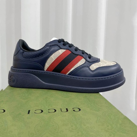 Gucci Dark Blue Leather Trainers Side View Side profile view of Gucci dark blue leather trainers with web pattern and chunky sole