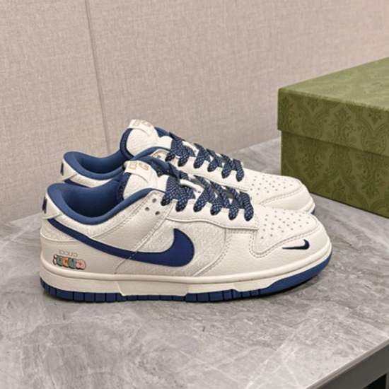 Gucci Low Top Leather Trainers In White And Blue Side Profile Gucci Low Top Leather Trainers In White And Blue side profile view on marble surface