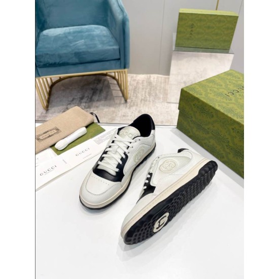 Gucci Mac80 Pair with Sole View in off-white and black Pair of off-white and black trainers displayed with rubber sole tread visible