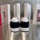Christian Louboutin Low Top Trainers Heel View in black and white Rear view of Christian Louboutin low top trainers highlighting black heel caps in black and white