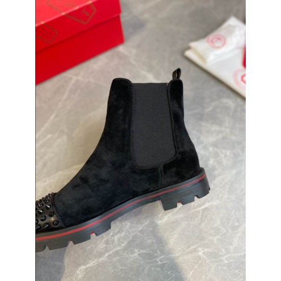Christian Louboutin Men's Black Studded Suede Chelsea Boots Sole Close-Up Close-up profile of Christian Louboutin Men's Black Studded Suede Chelsea Boot showing heel and sole construction