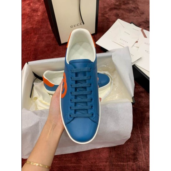Blue Leather Trainer Top View in blue and orange Top-down view of single blue leather trainer showing tongue, laces and lining in blue and orange