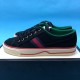 Gucci Off The Grid Black Canvas Trainer Medial View in black and green Medial side view of the Gucci Off The Grid black canvas trainer displaying side stripe and sole details in black and green