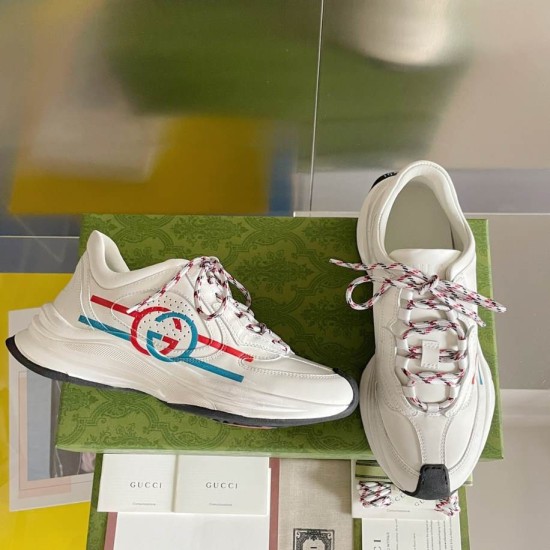 Gucci Run Leather Trainers In White Pair View in white and red Gucci Run Leather Trainers In White displayed as a pair on presentation box showing side and front angles in white and red