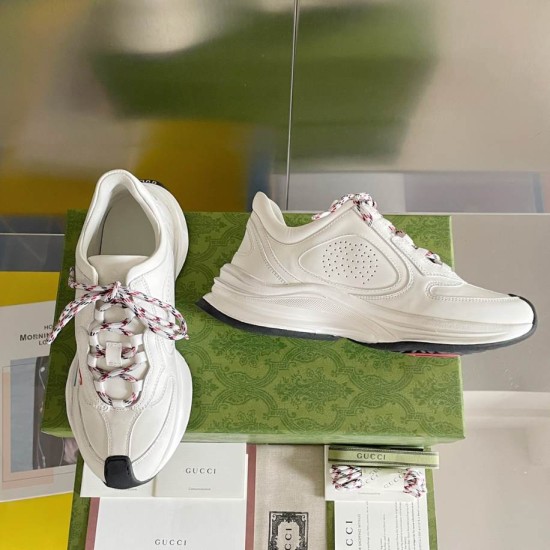 Gucci Run Leather Trainers In White Medial View in white and red Gucci Run Leather Trainers In White showing plain medial side panel and front toe profile in white and red