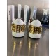 Christian Louboutin Low Top Mesh Spiked Heel Counter View in black and white Rear view showcasing the metallic gold spiked heel counters on Christian Louboutin trainers in black and white
