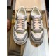 Gucci Monogram Low Top Overhead View in beige and white Overhead view of both Gucci monogram trainers in beige canvas and grey leather with green accents in beige and white