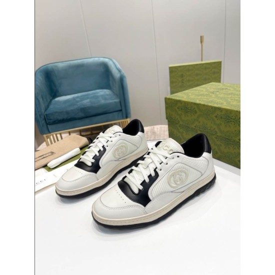 Gucci Mac80 Front Perspective in off-white and black Front perspective view of off-white leather trainers with black eyestay overlays