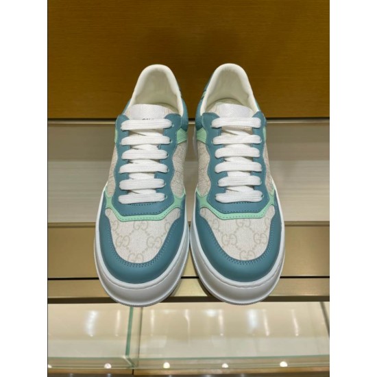 Gucci Monogram Canvas Trainers Front View in blue and white Front view of both blue and white Gucci monogram low-top trainers with white laces