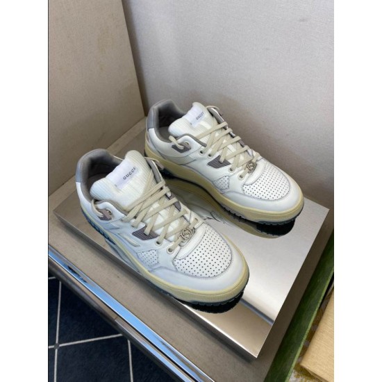 Gucci White Grey Distressed Trainers Pair Overview Pair of Gucci white and grey distressed leather trainers displayed on reflective surface