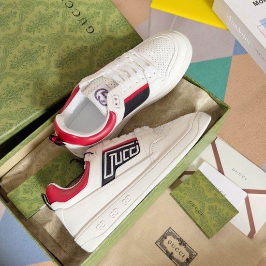 Gucci White Leather Low-Top Trainers With Red Trim resting inside green branded box