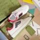 Gucci White Leather Low-Top Trainers With Red Trim resting inside green branded box