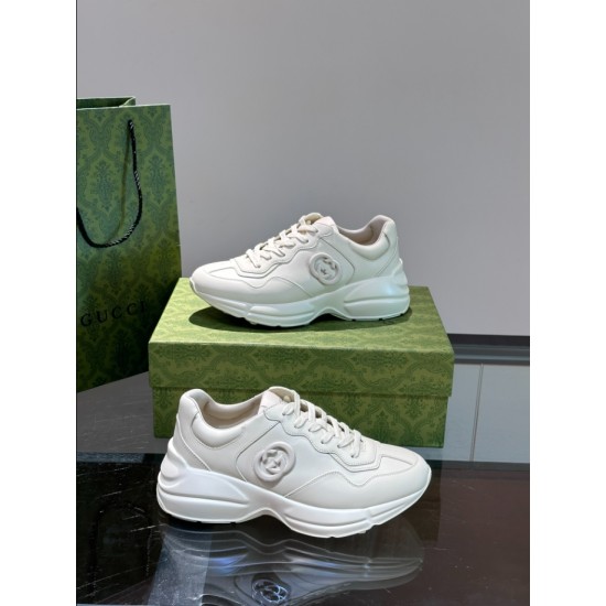 Both off-white leather trainers displayed together from side angle