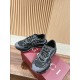 Gucci Ripple Trainers Box Display in black and grey Pair of black and grey Gucci trainers positioned on a red shoe box