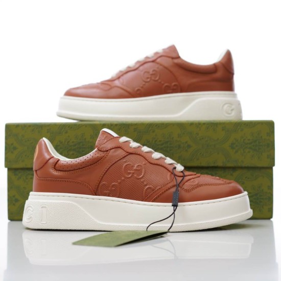 Pair of Gucci brown jumbo GG embossed trainers presented with branded box