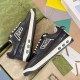 Gucci Black Leather Low Top Trainers outer side profile showing graphic embroidery in black and white