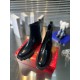 Christian Louboutin Men's Black Leather Chelsea Boots Front Pair View Front perspective view of both Christian Louboutin Men's Black Leather Lug Sole Chelsea Boots highlighting front seams and soles.
