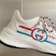 Gucci Run Leather Trainers In White Detail View in white and red Close-up detail of Gucci Run Leather Trainers In White showing perforated leather and Interlocking G logo in white and red