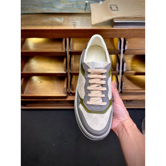 Gucci Monogram Low Top Single Shoe View in beige and white Hand holding a single Gucci monogram low top trainer in white and beige leather from above