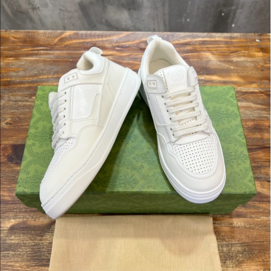 Gucci White Leather Low Top Trainers Pair View in white and green Gucci White Leather Low Top Trainers elevated pair view displaying side panels in white and green