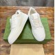 Gucci White Leather Low Top Trainers Pair View in white and green Gucci White Leather Low Top Trainers elevated pair view displaying side panels in white and green