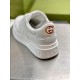 Close-up of the heel detailing on Gucci white trainer showing gold emblem and embossed midsole logo