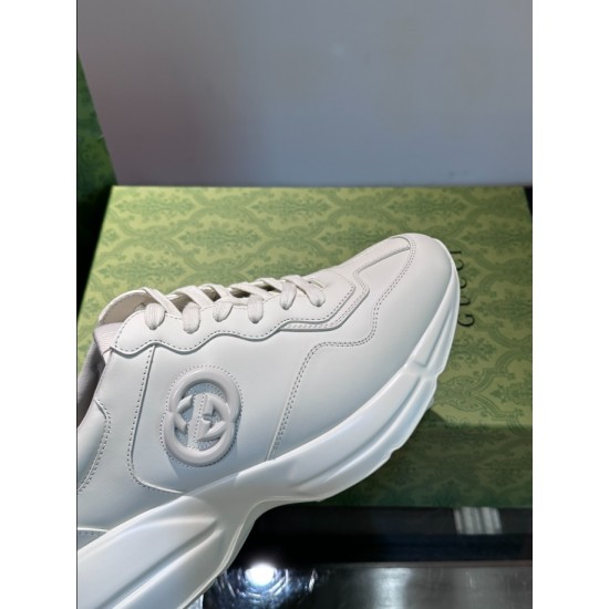 Close-up view of off-white trainer featuring side interlocking logo motif