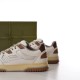 Close-up rear quarter angle focusing on the padded collar and brown heel panel in white and brown
