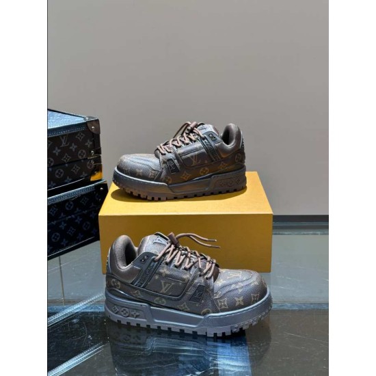 L Maxi Monogram Canvas Low Top Trainers in ebony brown dual arrangement Angled perspective of L Maxi Monogram Canvas Low Top Trainers in ebony brown displayed together