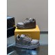 L Maxi Monogram Canvas Low Top Trainers in ebony brown dual arrangement Angled perspective of L Maxi Monogram Canvas Low Top Trainers in ebony brown displayed together