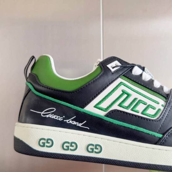 Gucci Screener Leather Trainers Green Black White close-up side branding detail