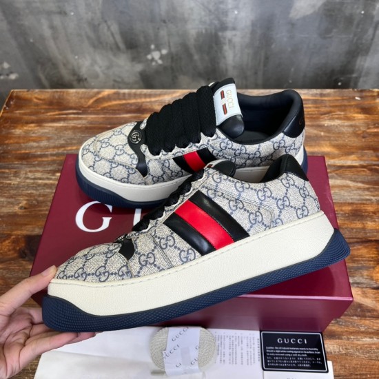 Gucci Screener Web Trainers Pair Angle in beige and blue Angled pair view of Gucci Screener Web Monogram Canvas Low Top Trainers in beige blue