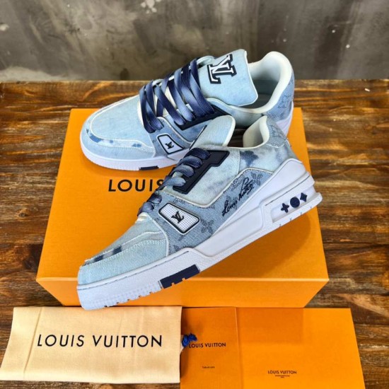 Overhead Angle of L Bleached Monogram Denim Blue Low Top Trainers Three-quarter overhead view of L bleached monogram denim blue low top trainers