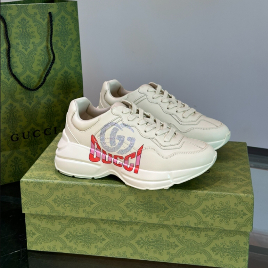 Gucci Ivory Leather Double G Chunky Trainers side profile view on box
